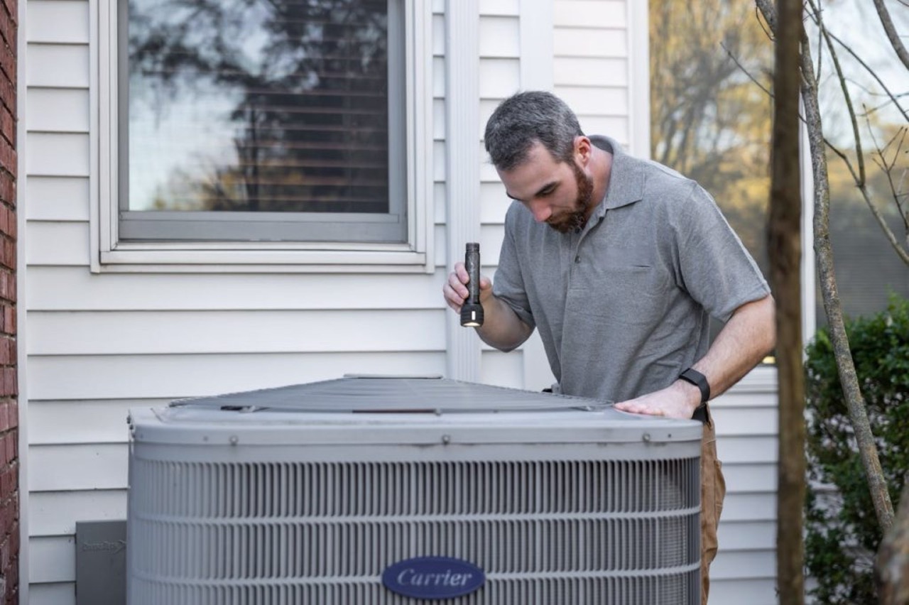 Service technician evaluating refrigeration equipment